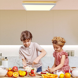 cute kids preparing a fruit salad in kitchen