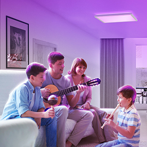 Parents and children playing guitar at home in the living room