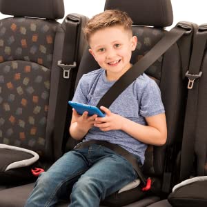 Image of Boy sitting on the middle seat of a car using the BubbleBum travel booster seat 