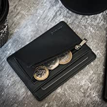 ultra thin black credit card holder zip wallet with coin pocket on the table