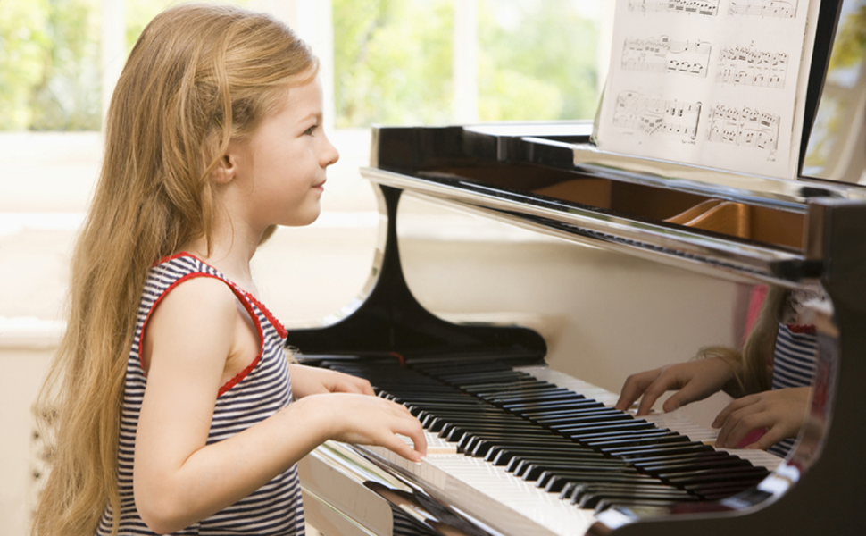 a girl playing the piano