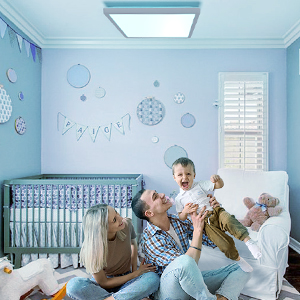 Happy family is having fun together in bedroom