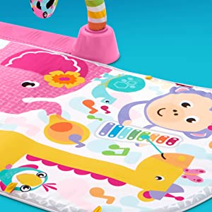 Soft, machine-washable mat with loops to attach toys